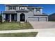 Two-story home with gray siding and three-car garage at 3295 Roseville Dr, Apopka, FL 32712
