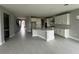 Open kitchen features white cabinets, an island, and tile floors at 3295 Roseville Dr, Apopka, FL 32712