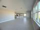Open living room with tile floors and kitchen views at 3295 Roseville Dr, Apopka, FL 32712