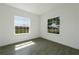 Bright bedroom with gray tile floors and two large windows at 1652 Cumin Dr, Poinciana, FL 34759