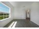 Bedroom with gray tile floors and a view of the community at 1652 Cumin Dr, Poinciana, FL 34759