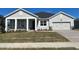 Craftsman style home with front porch and two car garage at 3287 Roseville Dr, Apopka, FL 32712