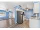 Bright kitchen features stainless steel appliances and light-grey tile flooring at 926 Everett St, Lake Alfred, FL 33850
