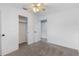 Bright bedroom with neutral walls, carpet, and a large closet at 926 Everett St, Lake Alfred, FL 33850