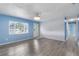 Living room with white brick wall and gray floors at 926 Everett St, Lake Alfred, FL 33850