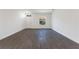 Open living room with gray tile floors and white walls at 1648 Cumin Dr, Kissimmee, FL 34759