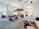 Spacious living room with a pool table, comfortable seating, and high ceilings at 24341 Milford Dr, Eustis, FL 32736