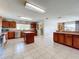 Well-equipped kitchen with an island, ample cabinetry, and stainless steel appliances at 24341 Milford Dr, Eustis, FL 32736