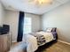 Bedroom with twin bed, large window, and ample closet space at 24341 Milford Dr, Eustis, FL 32736