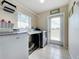 Convenient laundry room with washer, dryer, and exterior access at 24341 Milford Dr, Eustis, FL 32736