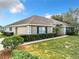 House exterior showcasing landscaping and lawn at 24341 Milford Dr, Eustis, FL 32736