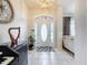 Bright and spacious entryway with tile flooring and access to the living room at 24341 Milford Dr, Eustis, FL 32736