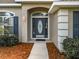 Inviting home exterior featuring a charming front door and well-manicured landscaping at 24341 Milford Dr, Eustis, FL 32736