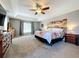 Main bedroom with king bed, large windows, and plenty of space at 24341 Milford Dr, Eustis, FL 32736