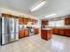 Modern kitchen featuring stainless steel appliances and an island with seating at 24341 Milford Dr, Eustis, FL 32736
