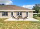 Inviting patio with seating area, perfect for outdoor relaxation at 24341 Milford Dr, Eustis, FL 32736