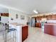 Kitchen with breakfast bar, stainless steel appliances, and lots of cabinet space at 24341 Milford Dr, Eustis, FL 32736