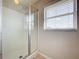 Bathroom with a shower and window for natural light at 24341 Milford Dr, Eustis, FL 32736