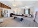 Open concept living room featuring a pool table and ample natural light at 24341 Milford Dr, Eustis, FL 32736