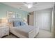 Bedroom with a queen bed and light blue walls at 5116 Killarney Way, Kissimmee, FL 34746