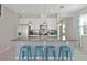 Modern kitchen with stainless steel appliances and granite countertops at 5116 Killarney Way, Kissimmee, FL 34746