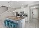Modern kitchen featuring granite countertops and white cabinetry at 5116 Killarney Way, Kissimmee, FL 34746