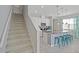 Kitchen features an island with seating and granite countertops at 5116 Killarney Way, Kissimmee, FL 34746