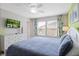 Main bedroom with king-size bed and green accent wall at 5116 Killarney Way, Kissimmee, FL 34746
