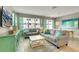 Spacious living room with light gray sofa and teal accents at 5116 Killarney Way, Kissimmee, FL 34746