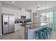 Modern kitchen with stainless steel appliances and granite countertops at 5116 Killarney Way, Kissimmee, FL 34746