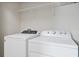 Laundry room with washer and dryer and overhead shelving at 5116 Killarney Way, Kissimmee, FL 34746