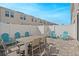 Private patio with gray table and teal chairs at 5116 Killarney Way, Kissimmee, FL 34746