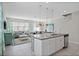 Open concept kitchen with granite island and stainless steel appliances at 5116 Killarney Way, Kissimmee, FL 34746