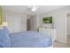 Main bedroom with king-size bed and green accent wall at 5116 Killarney Way, Kissimmee, FL 34746
