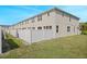 Townhouse exterior with white vinyl fence and lawn at 5116 Killarney Way, Kissimmee, FL 34746