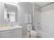 Bathroom with bathtub, toilet, and white vanity at 5116 Killarney Way, Kissimmee, FL 34746