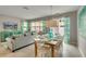 Bright dining room with a wooden table and seating for six at 5116 Killarney Way, Kissimmee, FL 34746