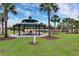 Community playground with pavilion and picnic tables at 5116 Killarney Way, Kissimmee, FL 34746