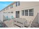 Private patio with gray table and teal chairs at 5116 Killarney Way, Kissimmee, FL 34746
