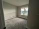 Bright bedroom with a large window and neutral wall colors at 3263 Roseville Dr, Apopka, FL 32712