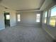 Spacious bedroom with carpet flooring and multiple windows at 3279 Roseville Dr, Apopka, FL 32712