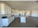Modern kitchen with white cabinets, island, and stainless steel appliances at 3279 Roseville Dr, Apopka, FL 32712