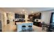 Modern kitchen with dark cabinets, stainless steel appliances, and island at 196 Taft Dr, Davenport, FL 33837