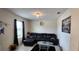 Living room with L-shaped sofa, coffee table, and large artwork at 196 Taft Dr, Davenport, FL 33837
