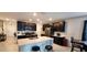 Modern kitchen with dark cabinets, stainless steel appliances, and island at 196 Taft Dr, Davenport, FL 33837