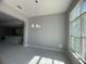 Dining area with chandelier, kitchen view, and large window at 3271 Roseville Dr, Apopka, FL 32712