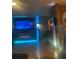 Home theater with large screen TV and electric fireplace at 8272 Le Mesa St, Orlando, FL 32827