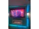 Home theater with large screen TV and electric fireplace at 8272 Le Mesa St, Orlando, FL 32827