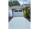 Spacious two-car garage with modern white door at 8272 Le Mesa St, Orlando, FL 32827