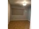 Simple bedroom with tile flooring, window coverings, and neutral walls at 8272 Le Mesa St, Orlando, FL 32827